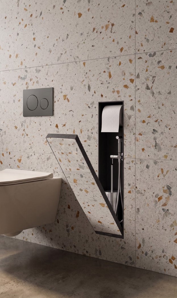 Roche Latent with its cover open in a terrazzo bathroom; the cover is clad with the same tiles as the wall